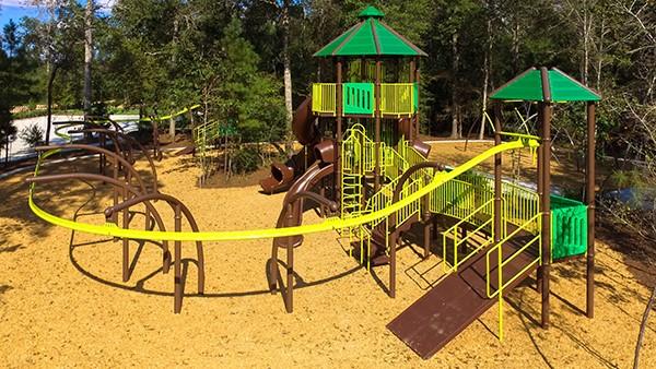 21015 Longeni Dr, New Caney, TX 77357 - communal playground with view of wooded area