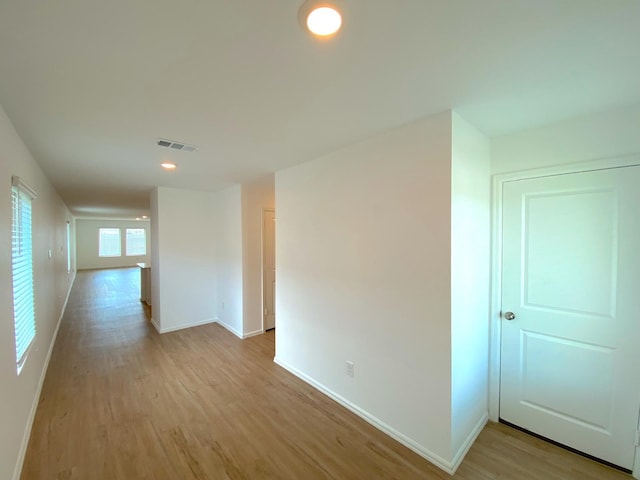 21015 Longeni Dr, New Caney, TX 77357 - corridor with light wood-style floors, baseboards, and recessed lighting