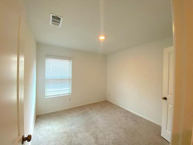 21015 Longeni Dr, New Caney, TX 77357 - spare room featuring carpet floors, baseboards, and recessed lighting