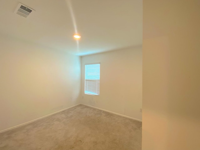 21015 Longeni Dr, New Caney, TX 77357 - spare room featuring carpet and baseboards