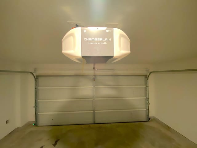 21015 Longeni Dr, New Caney, TX 77357 - garage with a garage door opener