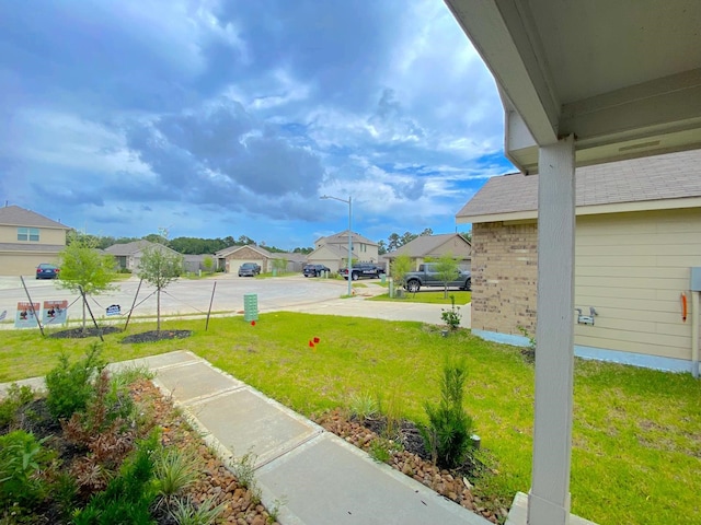 21015 Longeni Dr, New Caney, TX 77357 - view of green lawn with a residential view