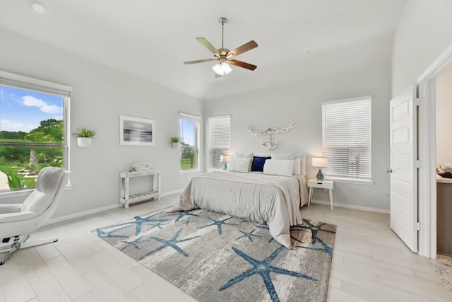 250 Peninsula Point Dr, Montgomery, TX 77356 - bedroom with multiple windows, light wood finished floors, and baseboards