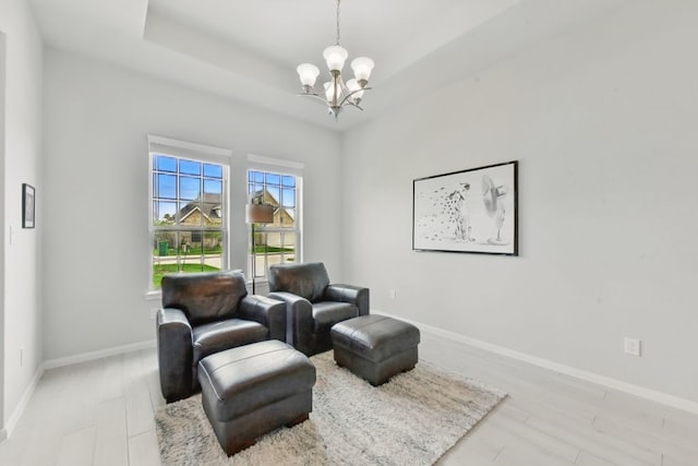 250 Peninsula Point Dr, Montgomery, TX 77356 - sitting room featuring a chandelier, baseboards, and light wood-style flooring