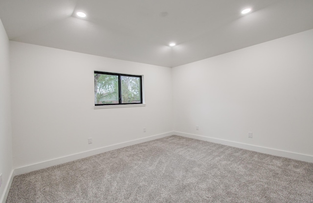 carpeted spare room with recessed lighting and baseboards