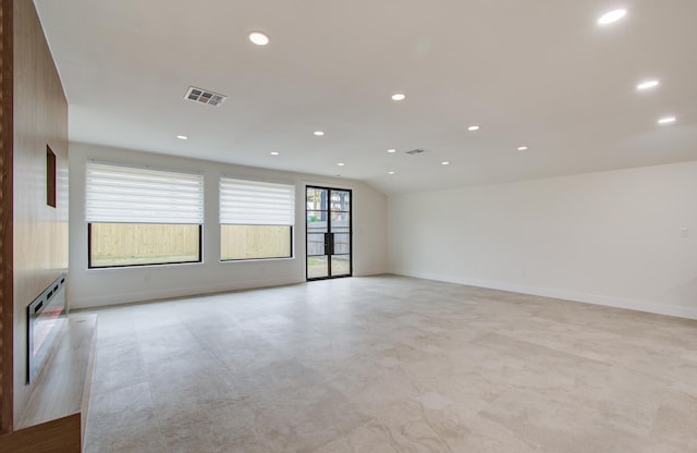 empty room with baseboards, recessed lighting, and visible vents