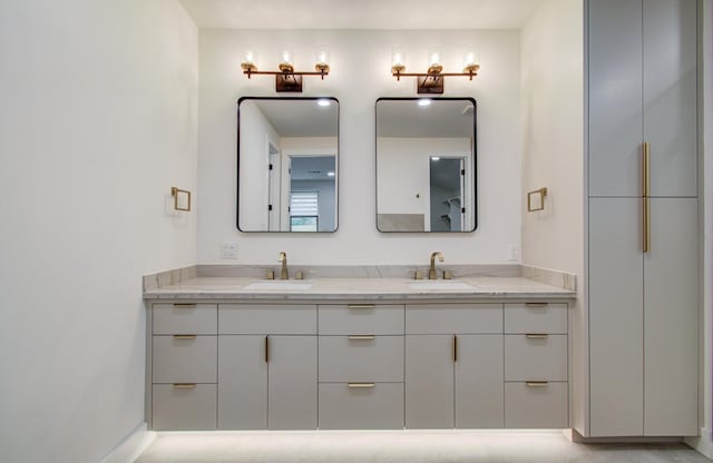 full bathroom featuring double vanity and a sink