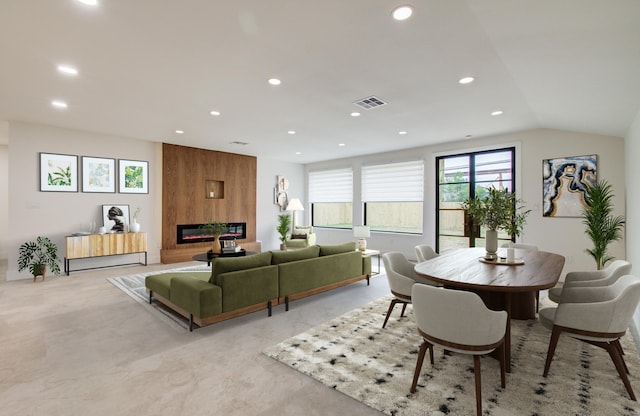 living area featuring recessed lighting, visible vents, and a fireplace