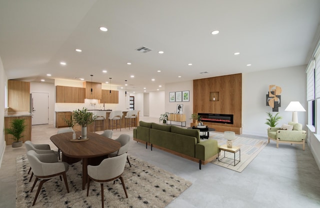 interior space featuring recessed lighting, visible vents, and a fireplace