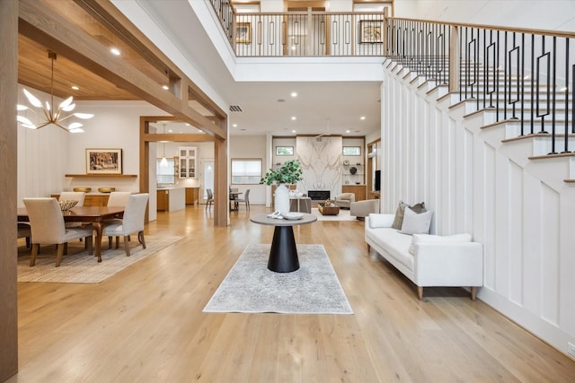 739 Azaleadell Dr, Houston, TX 77018 - foyer entrance with stairs, wood finished floors, a chandelier, a towering ceiling, and recessed lighting