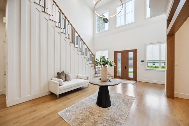 739 Azaleadell Dr, Houston, TX 77018 - foyer with a towering ceiling, light wood-style floors, baseboards, and stairs
