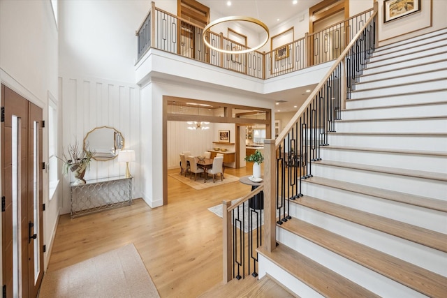 739 Azaleadell Dr, Houston, TX 77018 - foyer with a chandelier, stairway, wood finished floors, and a towering ceiling