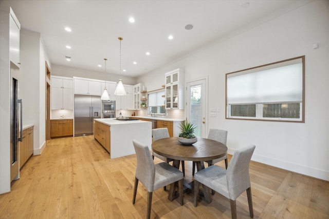 739 Azaleadell Dr, Houston, TX 77018 - dining space featuring light wood-style floors, recessed lighting, and baseboards