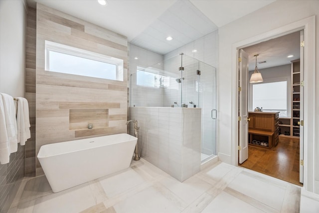 739 Azaleadell Dr, Houston, TX 77018 - full bathroom featuring a soaking tub, recessed lighting, a shower stall, and tile walls