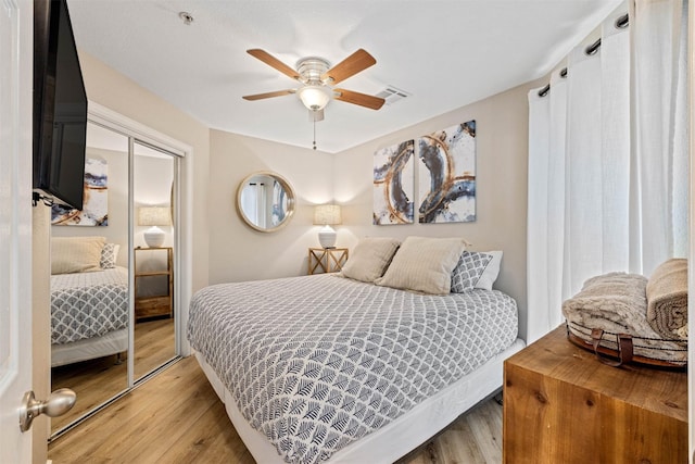 9520 Seawall Blvd Unit 254, Galveston, TX 77554 - bedroom with light wood finished floors and a ceiling fan