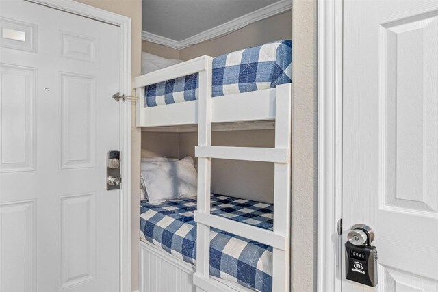 9520 Seawall Blvd Unit 254, Galveston, TX 77554 - bedroom featuring ornamental molding