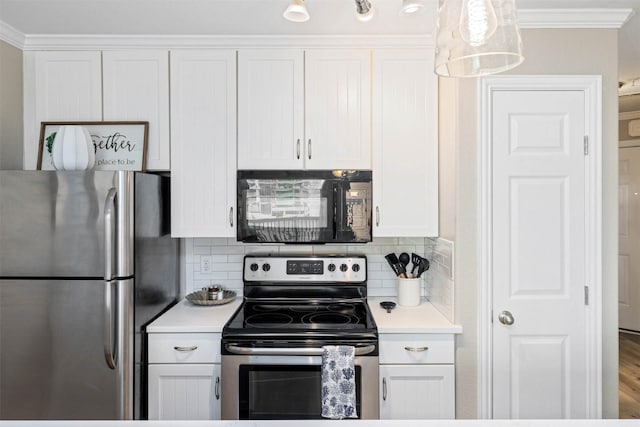 9520 Seawall Blvd Unit 254, Galveston, TX 77554 - kitchen featuring appliances with stainless steel finishes, white cabinets, light countertops, and crown molding