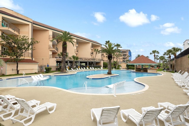 9520 Seawall Blvd Unit 254, Galveston, TX 77554 - community pool featuring a gazebo, a patio area, and fence
