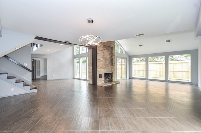 2918 Manila Ln, Houston, TX 77043 - unfurnished living room with a chandelier, lofted ceiling, a fireplace, stairway, and baseboards