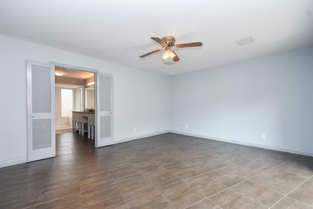 2918 Manila Ln, Houston, TX 77043 - unfurnished room with ceiling fan and baseboards