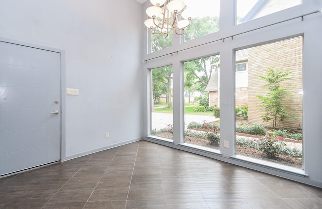 2918 Manila Ln, Houston, TX 77043 - entryway featuring a chandelier, a high ceiling, and baseboards