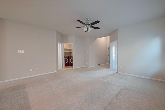 2402 Ivory Ct, Texas City, TX 77591 - empty room with washing machine and clothes dryer, ceiling fan, baseboards, and light colored carpet