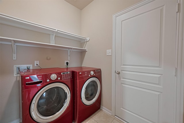 2402 Ivory Ct, Texas City, TX 77591 - washroom with light tile patterned flooring, baseboards, washing machine and clothes dryer, and laundry area