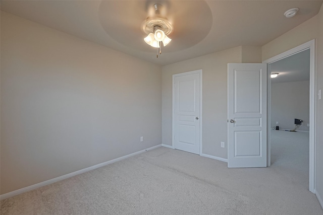 2402 Ivory Ct, Texas City, TX 77591 - unfurnished bedroom with baseboards, ceiling fan, and light carpet