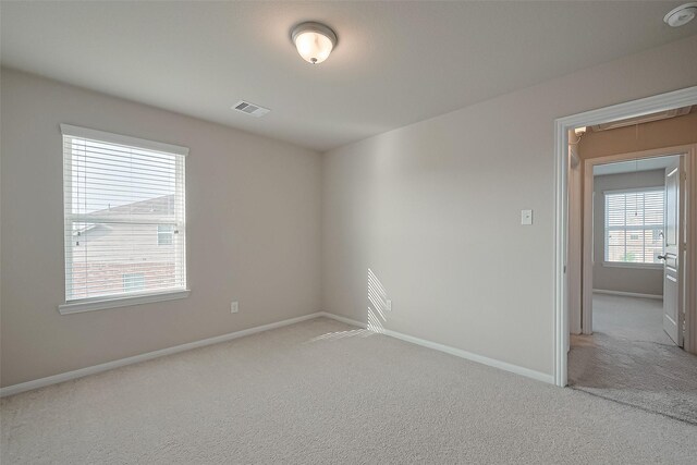 2402 Ivory Ct, Texas City, TX 77591 - carpeted spare room with attic access, baseboards, and visible vents