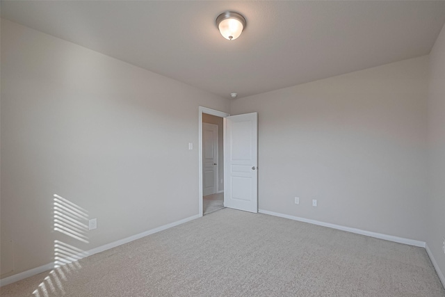 2402 Ivory Ct, Texas City, TX 77591 - empty room featuring baseboards and light carpet