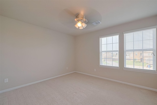 2402 Ivory Ct, Texas City, TX 77591 - unfurnished room featuring light colored carpet, baseboards, ceiling fan, and visible vents