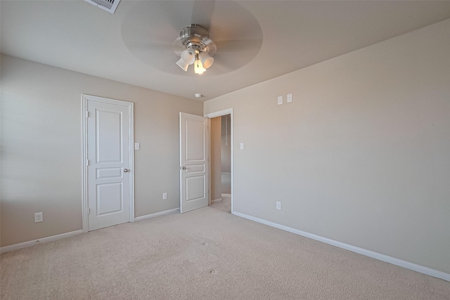 2402 Ivory Ct, Texas City, TX 77591 - unfurnished bedroom with light carpet, baseboards, visible vents, and a ceiling fan