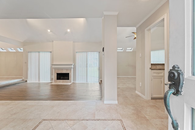 3708 Masters Ct, League City, TX 77573 - living room with ceiling fan, a fireplace with flush hearth, baseboards, ornamental molding, and light tile patterned floors