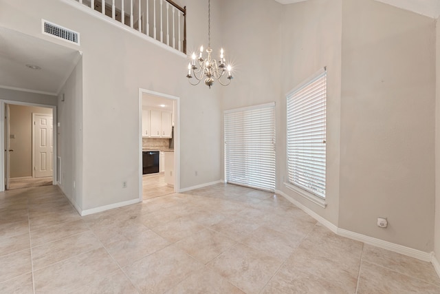 3708 Masters Ct, League City, TX 77573 - unfurnished dining area featuring a chandelier, baseboards, light tile patterned flooring, ornamental molding, and a high ceiling