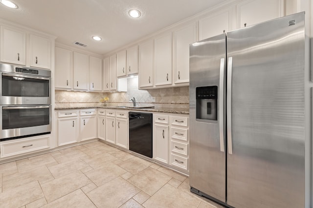 3708 Masters Ct, League City, TX 77573 - kitchen with stainless steel appliances, recessed lighting, light stone countertops, a sink, and white cabinetry