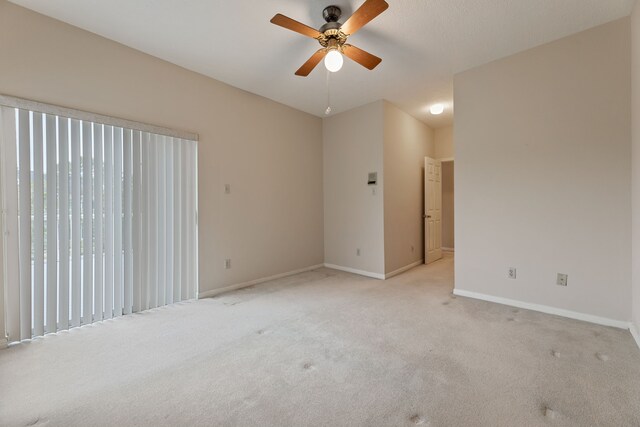 3708 Masters Ct, League City, TX 77573 - empty room featuring ceiling fan, light colored carpet, and baseboards