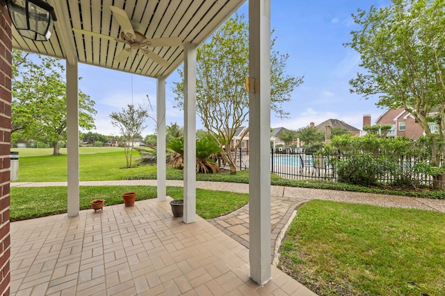 3708 Masters Ct, League City, TX 77573 - view of patio / terrace with a ceiling fan, a community pool, and a residential view