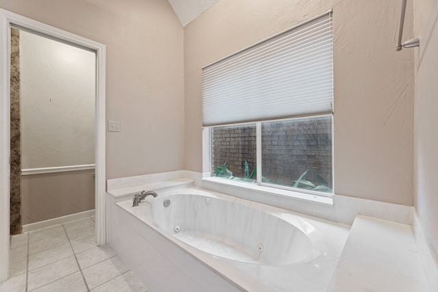 3708 Masters Ct, League City, TX 77573 - bathroom with tile patterned floors, a tub with jets, and lofted ceiling