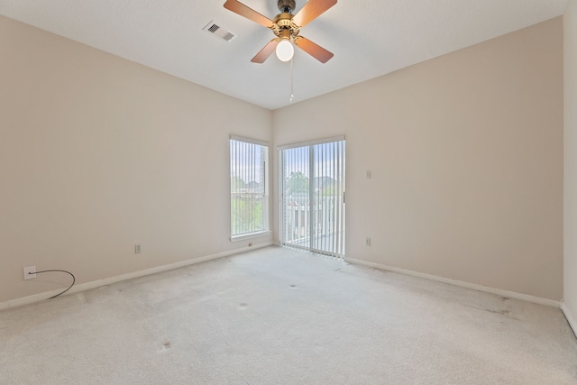 3708 Masters Ct, League City, TX 77573 - empty room featuring light colored carpet, baseboards, and a ceiling fan