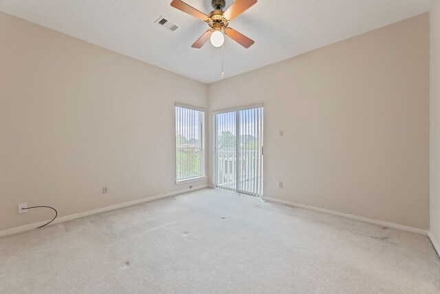 3708 Masters Ct, League City, TX 77573 - empty room with light carpet, baseboards, and a ceiling fan