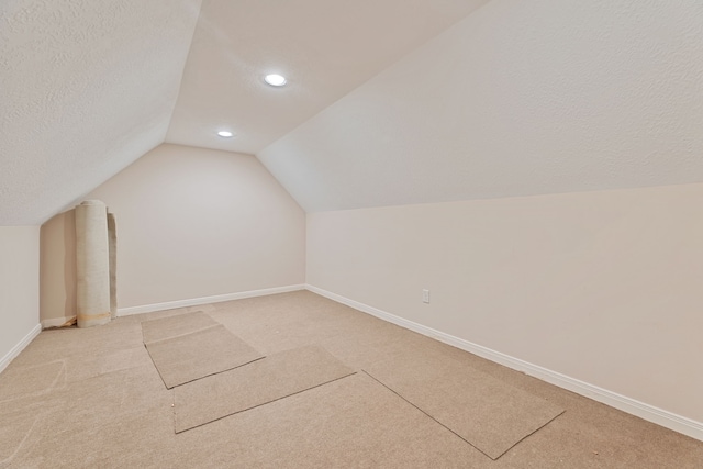 3708 Masters Ct, League City, TX 77573 - additional living space with vaulted ceiling, light carpet, baseboards, recessed lighting, and a textured ceiling