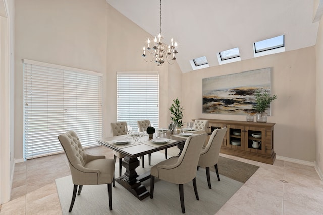 3708 Masters Ct, League City, TX 77573 - dining room featuring a skylight, a chandelier, high vaulted ceiling, light tile patterned floors, and baseboards