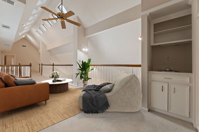 3708 Masters Ct, League City, TX 77573 - carpeted living area featuring a sink, ceiling fan, and high vaulted ceiling