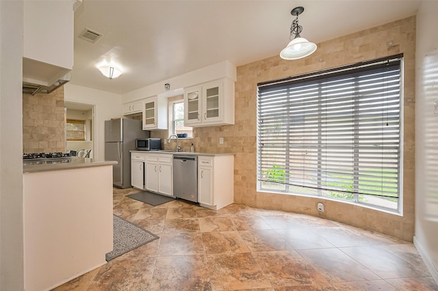 kitchen with visible vents, a wealth of natural light, white cabinetry, and stainless steel appliances