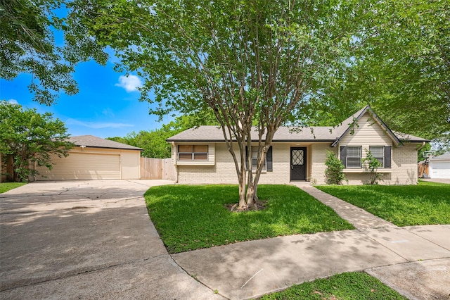 single story home featuring driveway, fence, a front lawn, and brick siding