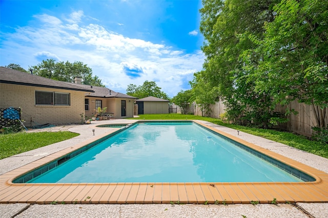 view of swimming pool with a fenced backyard, a fenced in pool, and a patio area