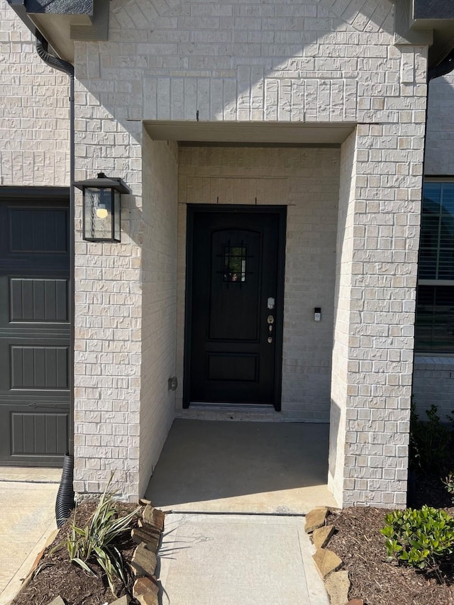 26767 Grandiflora Dr, Magnolia, TX 77355 - doorway to property featuring brick siding