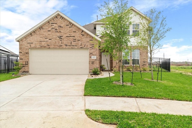 traditional-style home featuring driveway, brick siding, fence, and a front yard