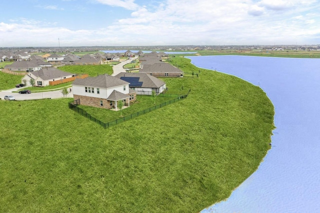 bird's eye view with a residential view and a water view