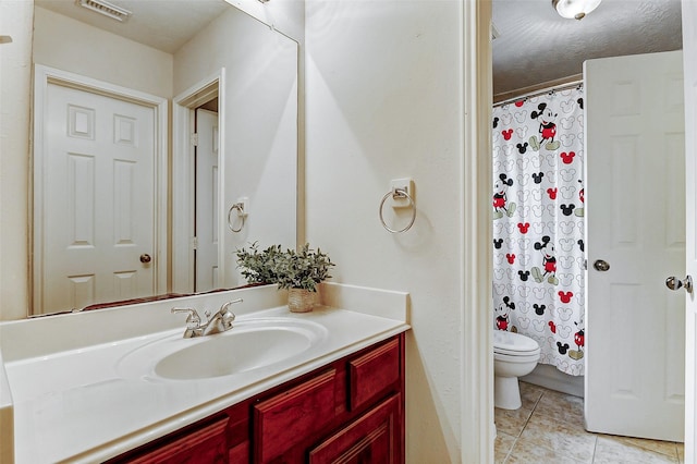 bathroom featuring vanity, toilet, tile patterned floors, and a shower with shower curtain
